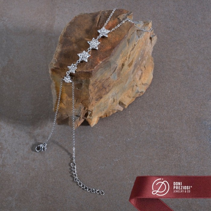 Baciamano in acciaio donna con stelle zirconate