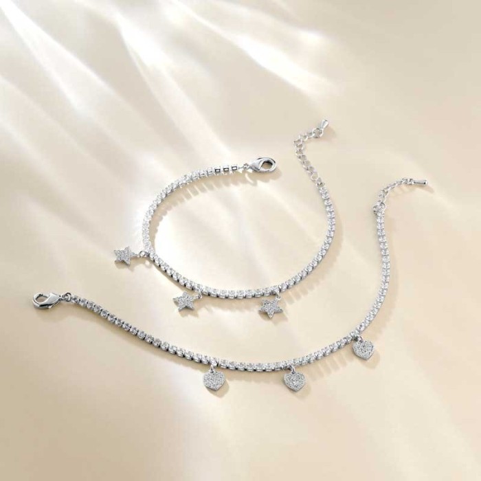 Bracciale tennis con cuori pendenti